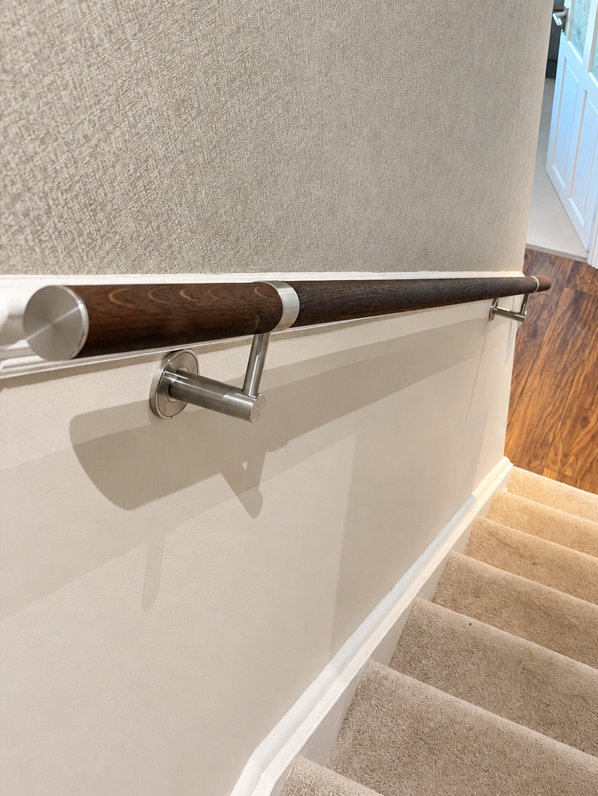 Dark Oak Wall-Mounted Handrail Installation for a Residential Staircase