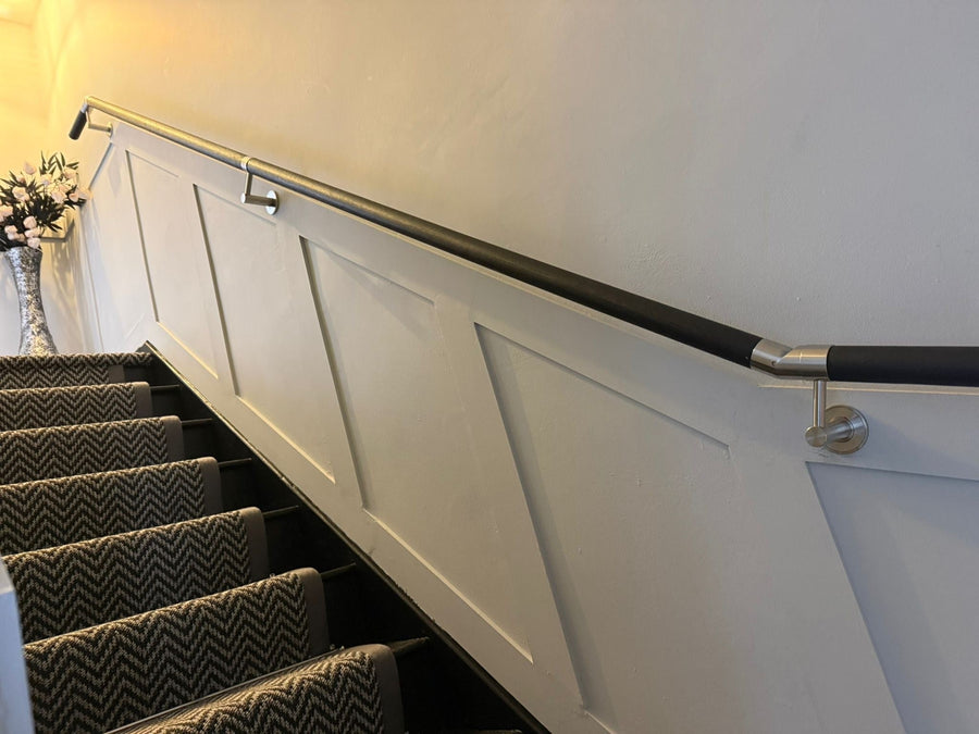 DIY Black Oak Handrail Installation on a Staircase with Wall Mouldings